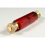 A VERY GOOD VICTORIAN FACET CUT RUBY GLASS DOUBLE ENDED SCENT BOTTLE with silver gilt repousse tops.
