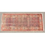 A PERSIAN MAHAL CARPET with a long blue and red central motif and deep border. 10ft 6ins x 4ft