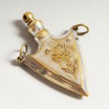 A NOVELTY ENGRAVED ARROW HEAD SHAPED SCENT BOTTLE, engraved with flowers. 6cms long.