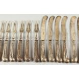 A SET OF TWELVE VICTORIAN PISTOL HANDLED KNIVES AND FORKS. Sheffield 1892.