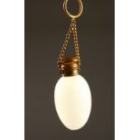 A FRENCH FROSTED GLASS EGG SHAPED SCENT BOTTLE with glass stopper, plated top on a chain.
