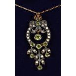 A 9CT GOLD AND SILVER PERIDOT, PEARL AND DIAMOND PENDANT on a chain, boxed.