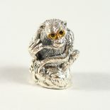 A NOVELTY SILVER MONKEY PIN CUSHION. 3cms high.