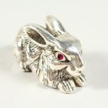 A NOVELTY RABBIT with ruby eyes. 5cms long.