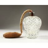 A HOBNAIL CUT GLASS ATOMISER with pump. 14cms high.