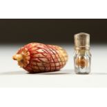 A TINY ACORN SHAPED SCREW OPENING CASE enclosing a glass scent bottle and stopper. 3cms long.