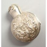 A VICTORIAN PLAIN GLASS SCENT BOTTLE AND STOPPER in a folding silver case repousse with figures.
