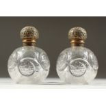 A SUPERB PAIR OF VICTORIAN STEVENS & WILLIAMS INTAGLIO CRYSTAL GLOBULAR SCENT BOTTLES AND