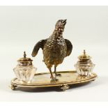 A SUPERB AUSTRIAN INKSTAND, with a painted cold cast bird, on an oval base with two cut glass