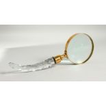 A MAGNIFYING GLASS with cut glass handle.