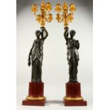 A VERY GOOD PAIR OF BRONZE, ORMOLU AND MARBLE CANDELABRA, modelled as a pair of classical femal