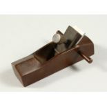 A MINIATURE BRONZE WOODWORKING PLANE. 3.5ins long.