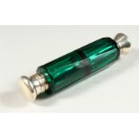 A VICTORIAN GREEN GLASS FACET CUT DOUBLE ENDED SCENT BOTTLE with glass stopper. 11.5cms long.