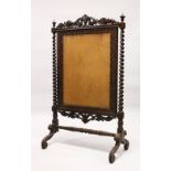 A VICTORIAN ROSEWOOD FRAMED FIRESCREEN with barley twist side columns (AF). 118cms high x 72cms