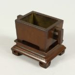 A SMALL CHINESE RECTANGULAR TWO HANDLED CENSER ON A STAND with four character impressed mark. 3.5ins