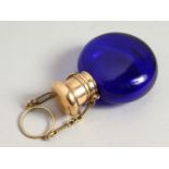 A 19TH CENTURY BRISTOL BLUE CIRCULAR SCENT BOTTLE with gilt cap and chain. 5cms diameter.