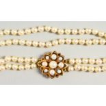 A VERY GOOD DOUBLE ROW PEARL CHOKER with 9ct gold and pearl clasp.