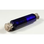 A VICTORIAN BRISTOL BLUE GLASS FACET CUT DOUBLE ENDED SCENT BOTTLE with repousse silver caps. 11.