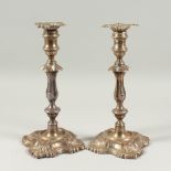 A LARGE PAIR OF SILVER CANDLESTICKS. London 1907. maker Hutton's. 12ins high.