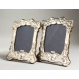 A PAIR OF ART NOUVEAU SILVER PHOTO FRAMES.