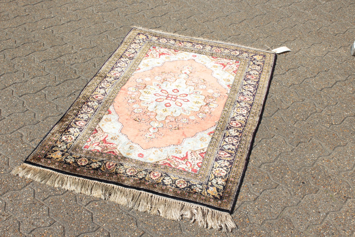 A FINE PERSIAN SILK RUG with central motif on a red background and floral border. 4ft 2ins x 2ft - Image 3 of 9