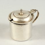 A GEORGE V PLAIN CIRCULAR MUSTARD POT AND COVER with sapphire blue liner. London 1912.