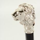 THE RITZ, LONDON. an umbrella with plated lion's head handle. 93cms long.