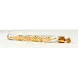 A 19TH CENTURY GLASS GILDED LONG SCENT BOTTLE with stopper and leaf decoration. 18cms long x 1.