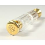 A GOOD VICTORIAN DOUBLE ENDED SCENT BOTTLE plain facet cut glass, silver gilt ends with vinaigrette.