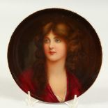 A PORTRAIT OF A YOUNG LADY CIRCULAR DISH. 7ins diameter.