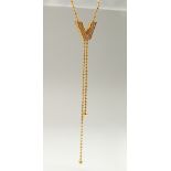 A SUPERB 18CT GOLD VERSACE "V" DIAMOND SET NECKLACE in a box.
