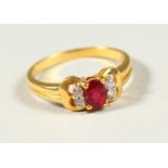 AN 18CT GOLD, DIAMOND AND RUBY RING.