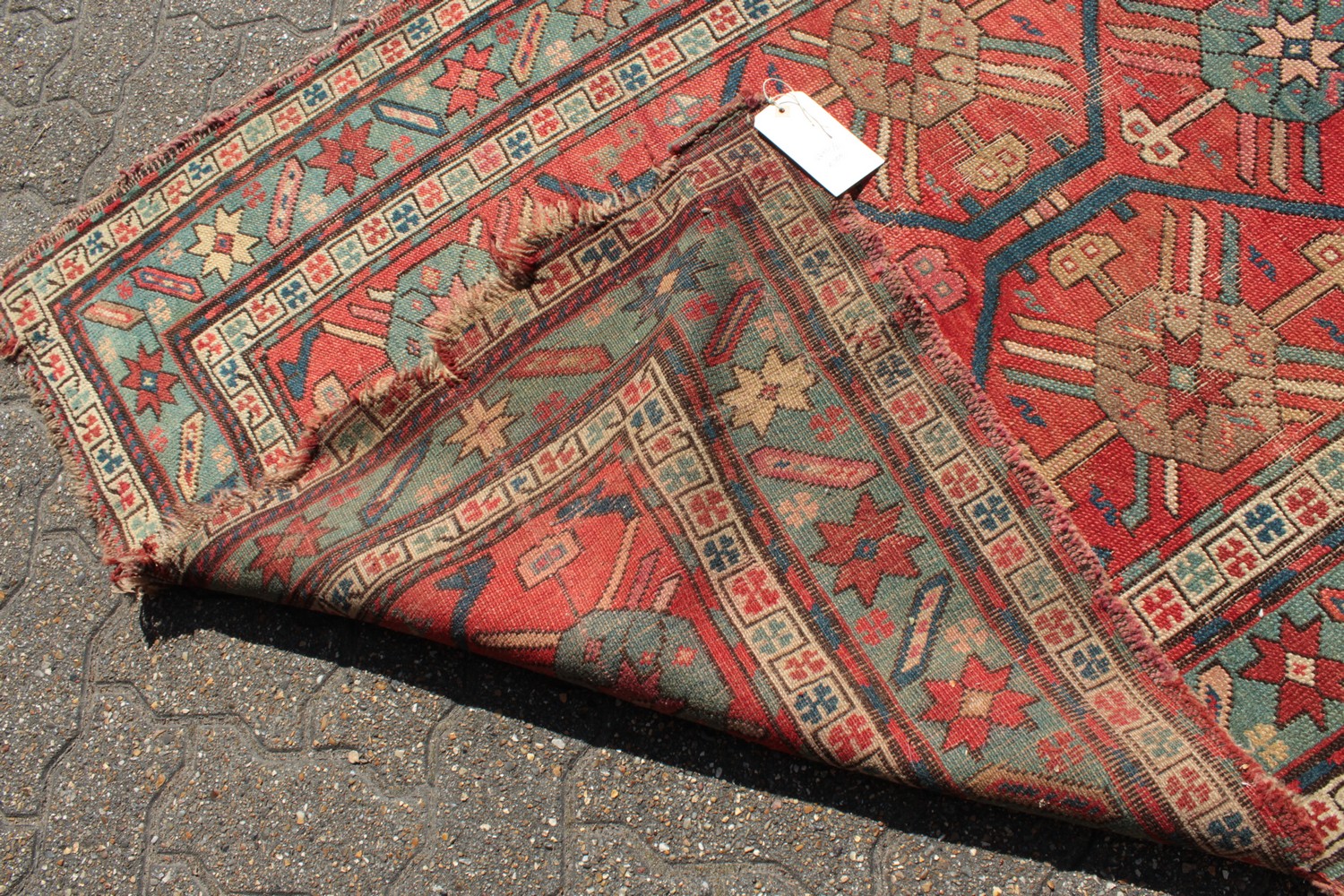 A CAUCASIAN RUNNER with typical motifs in red and blue. 10ft 9ins x 3ft 6ins. - Image 7 of 8