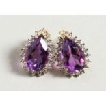 A GOOD PAIR OF 9CT GOLD TEAR DROP AMETHYST AND DIAMOND EARRINGS.