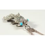 A LARGE SILVER ARTICULATED TURQUOISE EYE FISH PENDANT on a chain.
