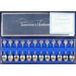 A SET OF TWELVE TEASPOONS, ZODIAC SIGNS, in original case.