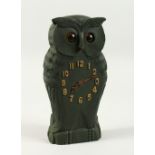 AN AMUSING CARVED WOOD OWL CLOCK with moveable eyes. 24cms high.
