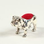 A NOVELTY SILVER BULLDOG PIN CUSHION. 3.5cms long.