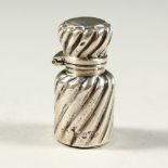 A TINY VICTORIAN SILVER RIBBED SCENT BOTTLE AND STOPPER. London 1875. Maker C. M. 3cms long.