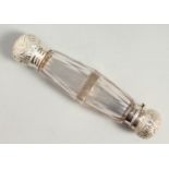 A VICTORIAN FACET CUT GLASS DOUBLE ENDED SCENT BOTTLE with lift off cap. with glass stopper, the