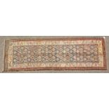 A PERSIAN QAZVIN KILIM CARPET. 11ft 3ins x 3ft 8ins.