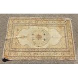 A PERSIAN TABRIZ HAJ-JALILI RUG with large central motif. 5ft 10ins x 3ft 10ins.