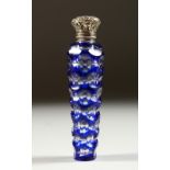 A GOOD VICTORIAN BLUE TINTED GLASS TAPERING SCENT BOTTLE with repousse silver cap and frosted