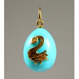 A GOLD MOUNTED TURQUOISE PENDANT.