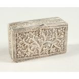 A CONTINENTAL SILVER SNUFF BOX DECORATED WITH TREES, the sides with a continuous border of motifs.