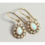 A PAIR OF 9CT GOLD PEAR SHAPED OPAL EARRINGS, boxed.