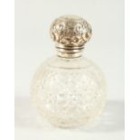 AN EDWARD VII CUT GLOBULAR SCENT BOTTLE with repousse screw off silver top. Birmingham 1908. 10cms