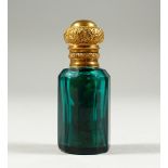 A VICTORIAN GREEN FACET CUT OCTAGONAL GLASS SCENT BOTTLE with gilt repousse top. 6.5cms high.