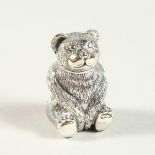 A NOVELTY SILVER TEDDY BEAR PIN CUSHION. 2.75cms high.