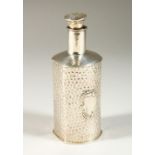 A VICTORIAN HAMMERED SILVER SCENT BOTTLE AND STOPPER. London 1900. Maker W. COMYNS. 13cms high.